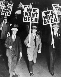 Men during Prohibition holding signs that read, We Want BEER
